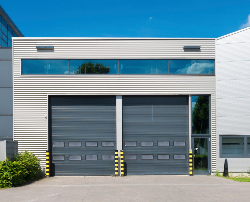 Front view of dark grey commercial garage doors
